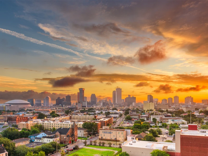 A cityscape in Louisiana at sunset.