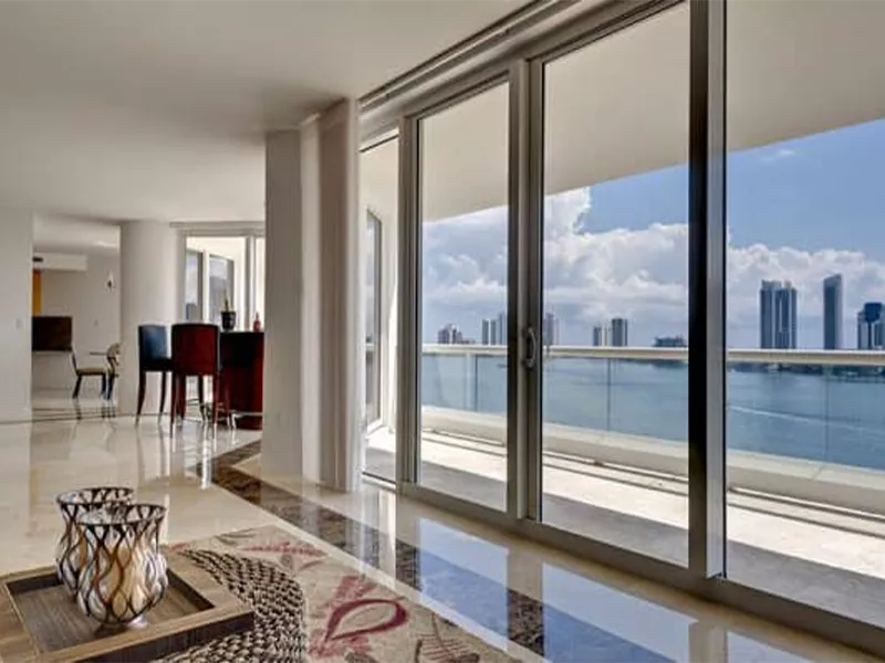 A wall of windows in a downtown condo.